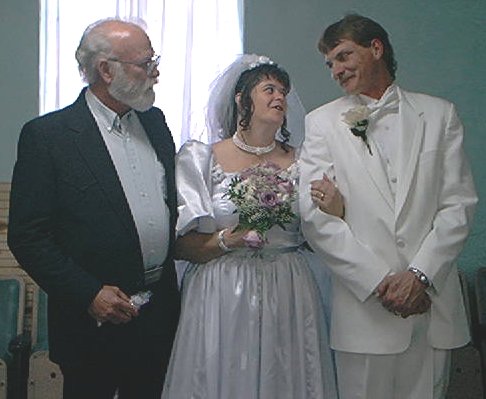 And who gives this bride away, Gale's step-father, Bill